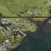 General oblique aerial view of the village centred on the quay and cottages, taken from the ENE.