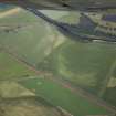 General oblique aerial view centred on the cropmarks of the rig and pits with the farmhouse and farmsteading and the cropmarks of the possible unenclosed settlement adjacent, taken from the ESE.