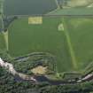 SOblique aerial view centred on the cropmarks of the rig with the cropmarks of the possible unenclosed settlement adjacent, taken from the NNW.