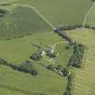 Oblique aerial view centred on the country house, dovecot and garden, taken from the WNW.