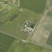 Oblique aerial view centred on the farmhouse and farmsteading, taken from the NW.