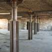 Interior. 3rd floor. View of cast-iron columns, beams and brick arched structure.