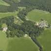 General oblique aerial view centred on the castle, tower-house, walled garden and farmsteading, taken from the W.