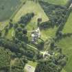 Oblique aerial view centred on the country house, dovecot, and remains of the chapel, taken from the NE.