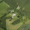 Oblique aerial view centred on the country house, dovecot, and remains of the chapel, taken from the WSW.