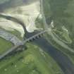 Oblique aerial view centred on the road bridge with the gate-lodge adjacent, taken from the SW.