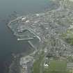 General oblique aerial view of the town, centred on the church and the harbour, taken from the SW.