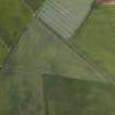 Oblique aerial view centred on the cropmarks of the enclosures, ring-ditch, rig and possible pit-alignment, taken from the SSE.