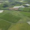 General oblique aerial view centred on the cropmarks of the enclosures, ring-ditch, rig and possible pit-alignment, taken from the NE.