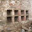 Abbey barn, detail of eight square recesses (nesting boxes) in N wall just beyond the end of the Abbey barn.