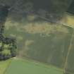 Oblique aerial view centred on the cropmarks of the possible enclosure and the pits, taken from the NW.