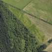 Oblique aerial view centred on the cropmarks of the unenclosed settlement, pits and possible souterrain, taken from the WNW.