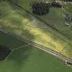 General oblique aerial view centred on the cropmarks of the settlement, taken from the NW.