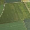 Oblique aerial view centred on the cropmarks of the pits, rig and unenclosed settlement with the cropmarks of the railway adjacent, taken from the E.