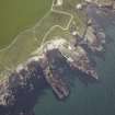 Oblique aerial view centred on Portsoy swimming pool, taken from the NE.