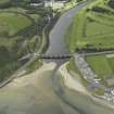 Oblique aerial view centred on the road bridge, taken from the NNW.