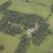 Oblique aerial view centred on the country house, walled garden, farmsteading and coach house, taken from the SE.
