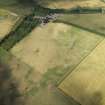 Oblique aerial view centred on the cropmarks of the possible barrow, taken from the ESE.