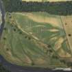 Oblique aerial view centred on the cropmarks of the possible enclosures and pits, taken from the SE.