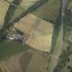 Oblique aerial view centred on the cropmarks of the Roman temporary camps and the linear cropmarks, taken from the SE.