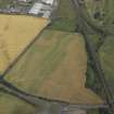Oblique aerial view centred on the cropmarks of the Roman temporary camp and rig, taken from the SW.