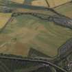 General oblique aerial view centred on the cropmarks of the Roman temporary camp and ring-ditches, taken from the S.