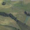 Oblique aerial view centred on the parchmarks of the enclosure, taken from the W.