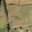 Oblique aerial view centred on the cropmarks of the Roman fort, Roman temporary camps and fort annexes, taken from the N.