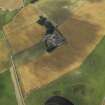 Oblique aerial view centred on the cropmarks of the rig and the farmhouse and farmsteading, taken from the E.