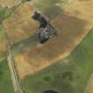 Oblique aerial view centred on the cropmarks of the rig and the farmhouse and farmsteading, taken from the ENE.