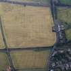 Oblique aerial view centred on the cropmarks of the field-system, taken from the NW.
