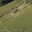 Oblique aerial view centred on the parchmarks of the fort, taken from the NE.