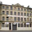 N Building. View from E of ashlar building with pediment at 104-106 Tradeston Street