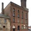 S Building. View from SSW, Cook Street elevation, note Ghibelline - style tower, Venetian Gothic windows, lancets, mschiolation at wall head.