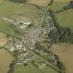 Oblique aerial view of the village centred on the church, taken from the S.