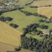 General oblique aerial view centred on the country house and gardens with the cottage adjacent, taken from the ESE.