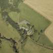 Oblique aerial view centred on the church, manse and burial-ground, taken from the S.