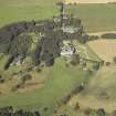 General oblique aerial view centred on the country house, dovecot, summerhouse, gate-lodge and walled garden, taken from the SE.
