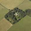 Oblique aerial view centred on the tower-house, stable, dovecot, cottage and walled garden, taken from the ESE.