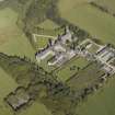 Oblique aerial view centred on the college, church, chapel, dovecot, walled garden and cottage, taken from the SW.
