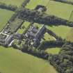 Oblique aerial view centred on the college, church, chapel, dovecot, walled garden and cottage, taken from the NE.