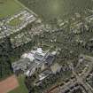 General oblique aerial view centred on the church and the school, taken from the SW.