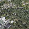 Oblique aerial view centred on the church and the school, taken from the S.