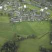 NNW oblique aerial view of Duntocher Roman Fort and Fortlet with  adjacent Trinity Parish Church.