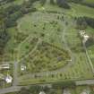 Oblique aerial view centred on the course of the Antonine Wall and the military way and the cemetery, taken from the S.