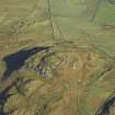 Oblique aerial view centred on the remains of the fort, taken from the SW.