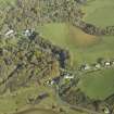 General oblique aerial view centred on the church with the village adjacent, taken from the SW.