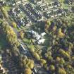 Oblique aerial view centred on the church, taken from the W.