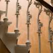 Interior view of the cast iron stair balustrade on the ground floor, 1 Moray Place, Glasgow.