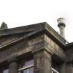 Detail of pediment and chimney can.